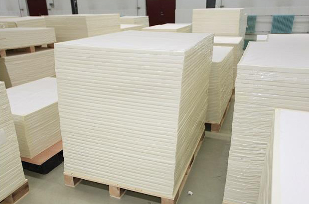 A photo showing stacks of cut stone paper on pallets.